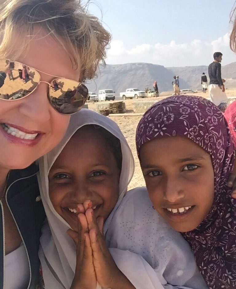 Larias with young refugee girls in Yemen