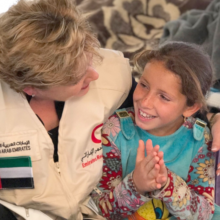 Larisa with young Syrian refugee